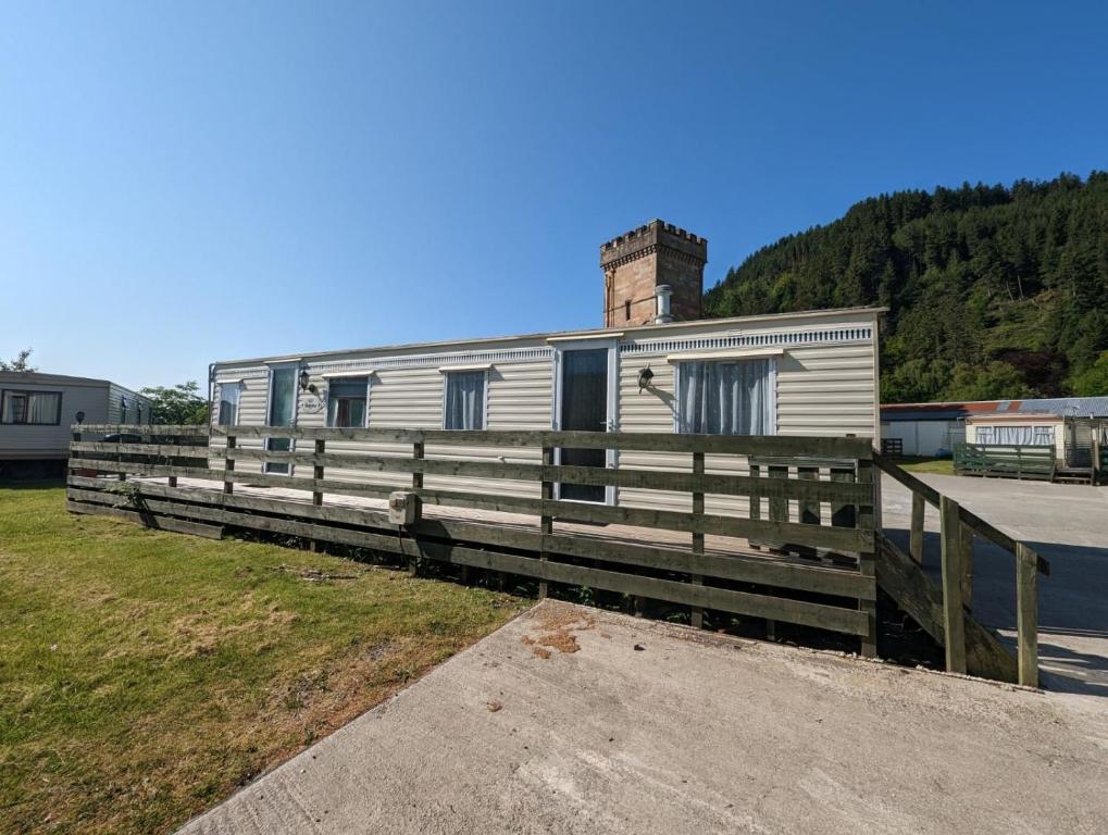 a trailer with a chimney on top of it at 30 Glenfinart Caravan Park in Dunoon