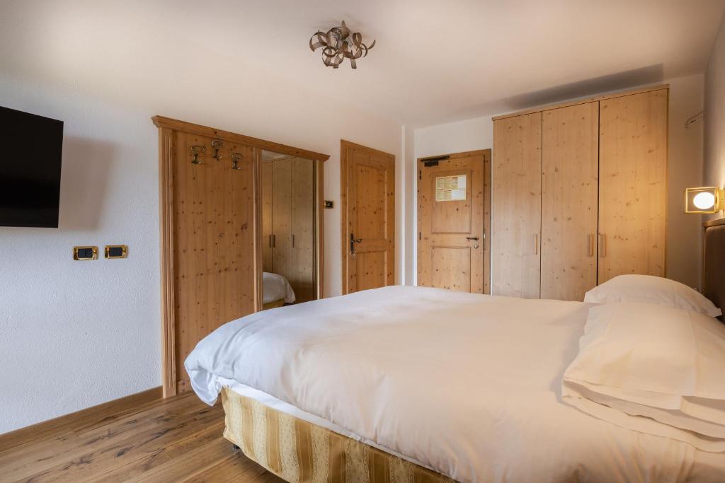 Postel nebo postele na pokoji v ubytování Hotel Stalon Alpine Chic