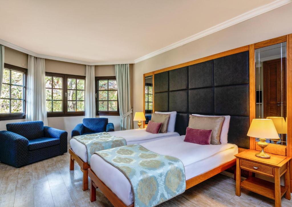 Postel nebo postele na pokoji v ubytování Asteria Family Resort Belek