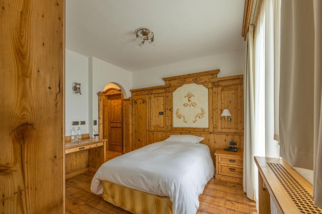 Postel nebo postele na pokoji v ubytování Hotel Stalon Alpine Chic