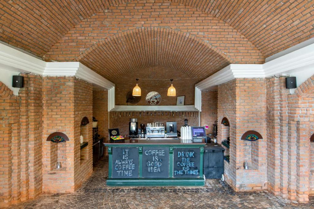 a kitchen with a counter in a brick building at Selectum Collection Bodrum in Akyarlar