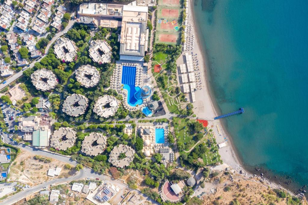 an aerial view of a resort next to the ocean at Selectum Collection Bodrum in Akyarlar