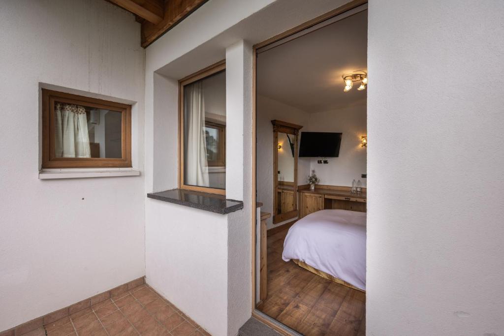 Postel nebo postele na pokoji v ubytování Hotel Stalon Alpine Chic