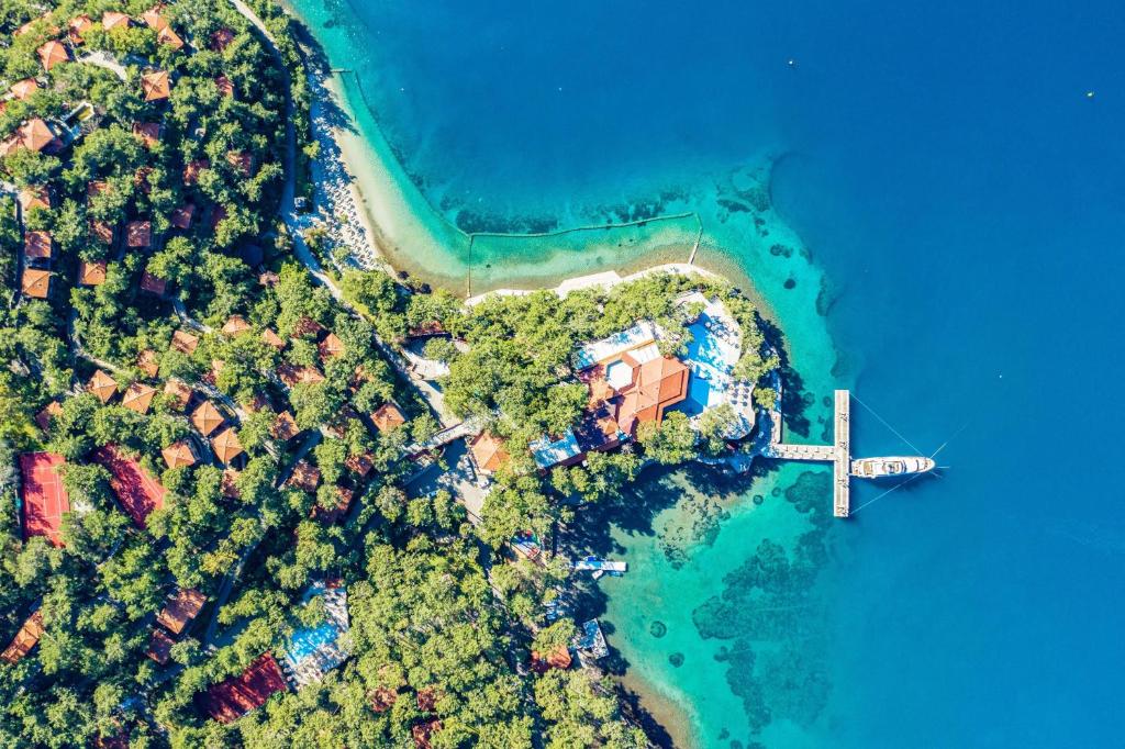 an aerial view of a house on a island in the water at Marmaris Bay Resort - Adults Only in Marmaris