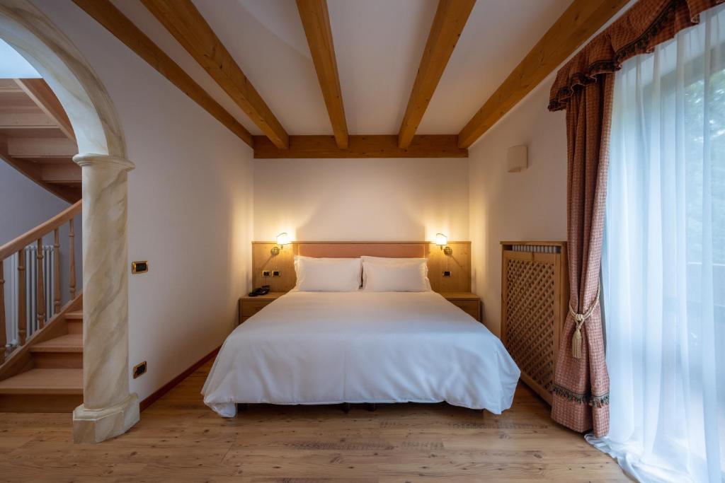 Postel nebo postele na pokoji v ubytování Hotel Stalon Alpine Chic