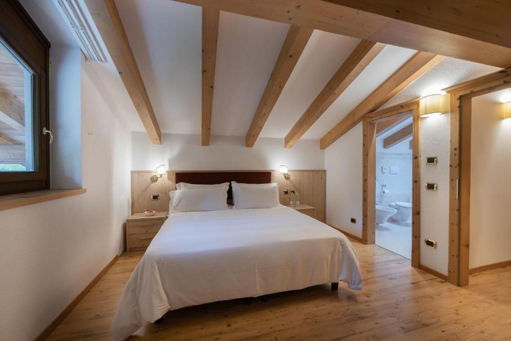 Postel nebo postele na pokoji v ubytování Hotel Stalon Alpine Chic