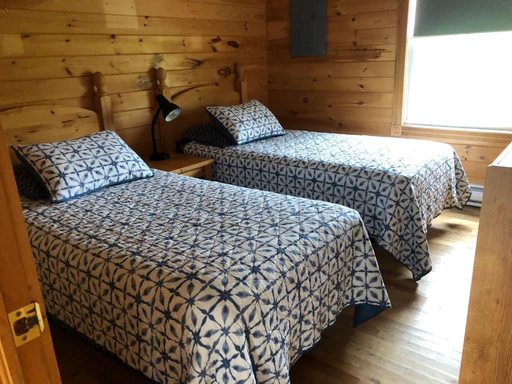 Ένα ή περισσότερα κρεβάτια σε δωμάτιο στο Stanhope Chalets