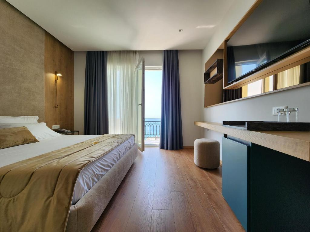Postel nebo postele na pokoji v ubytování Hotel Gold