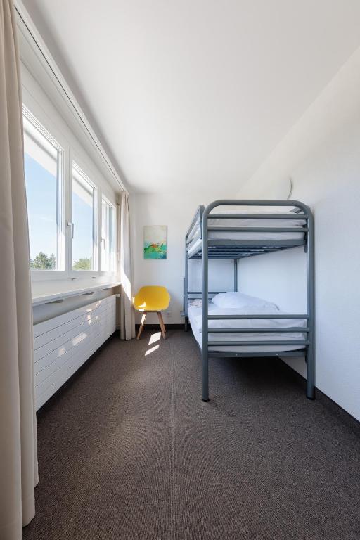 Postel nebo postele na pokoji v ubytování Le Domaine (Swiss Lodge)