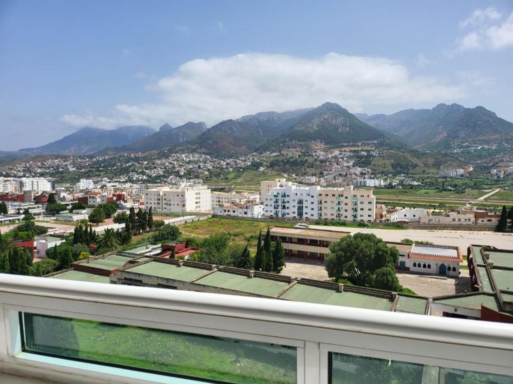 a view of a city with mountains in the background at Vaste appartement au centre de Tetouan in Tétouan