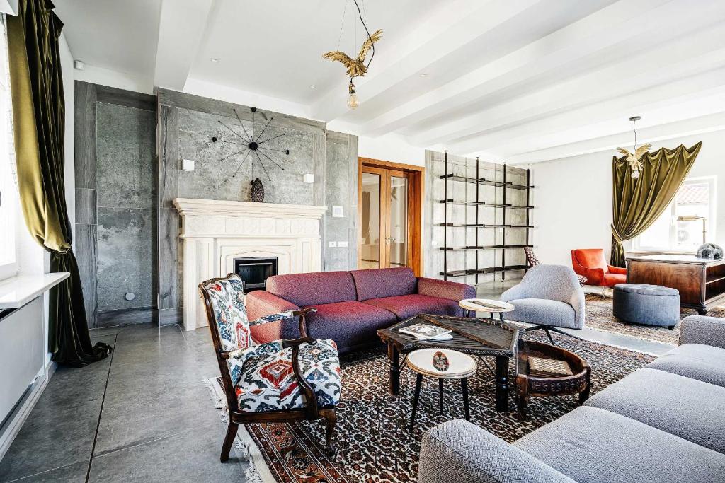 a living room with a couch and a fireplace at Villa Shah Complex in Kotor