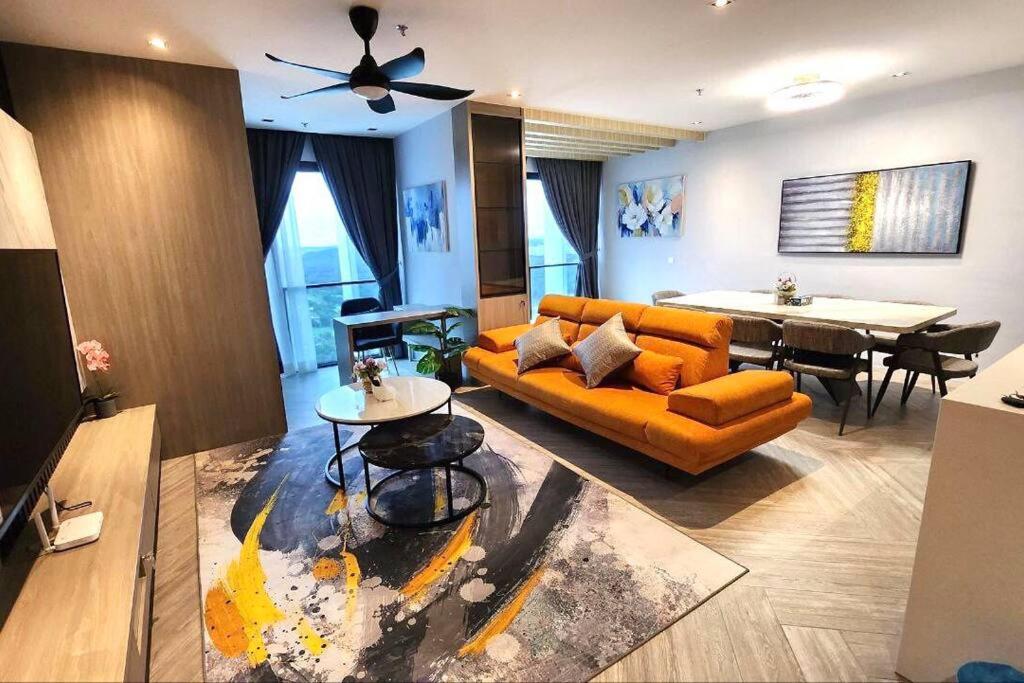 a living room with a couch and a table at Lumi Tropicana (2 in 1) sleep up to 18 in Petaling Jaya