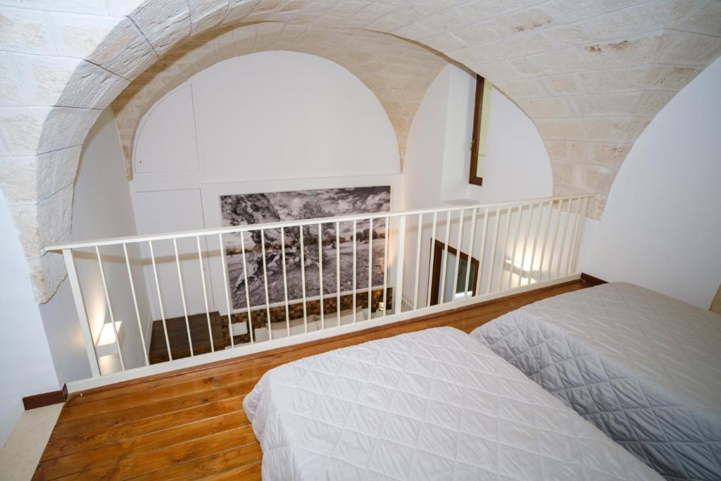 Postel nebo postele na pokoji v ubytování Welcome Ostuni b&b