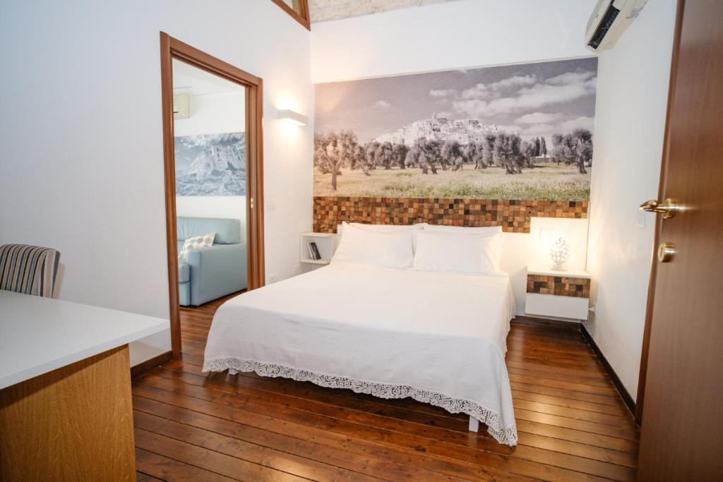 Postel nebo postele na pokoji v ubytování Welcome Ostuni b&b
