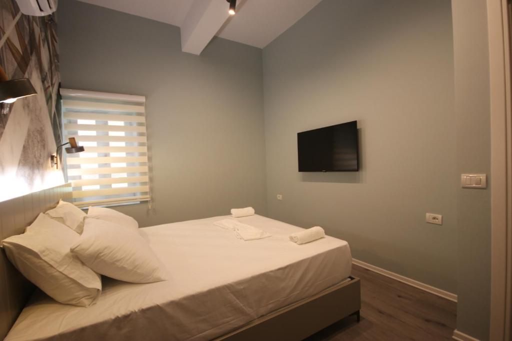 Postel nebo postele na pokoji v ubytování Alyvia Rooms
