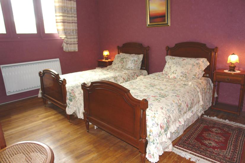 Postel nebo postele na pokoji v ubytování Les Etangs de Pitié