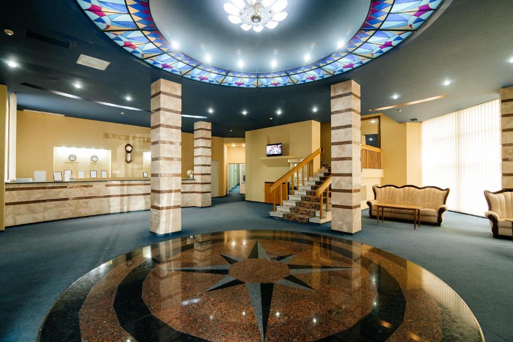 a lobby with a star in the middle of a room at Dacia Hotel in Chişinău