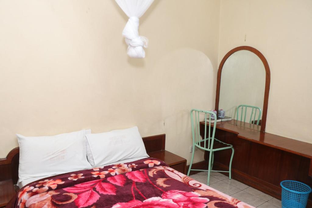 Postel nebo postele na pokoji v ubytování KAP Guest House