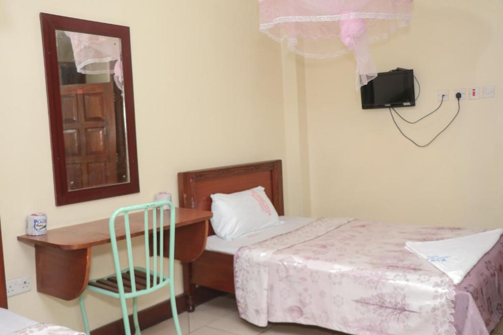 Postel nebo postele na pokoji v ubytování KAP Guest House