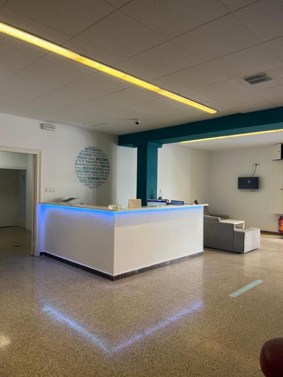an office with a reception desk in a room at Hostal San Carlos in Lloret de Mar