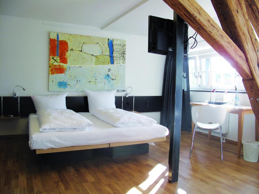 Postel nebo postele na pokoji v ubytování OX Hotel