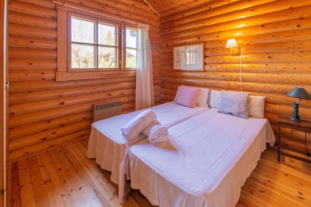 Posteľ alebo postele v izbe v ubytovaní La Cabane de Bajanda