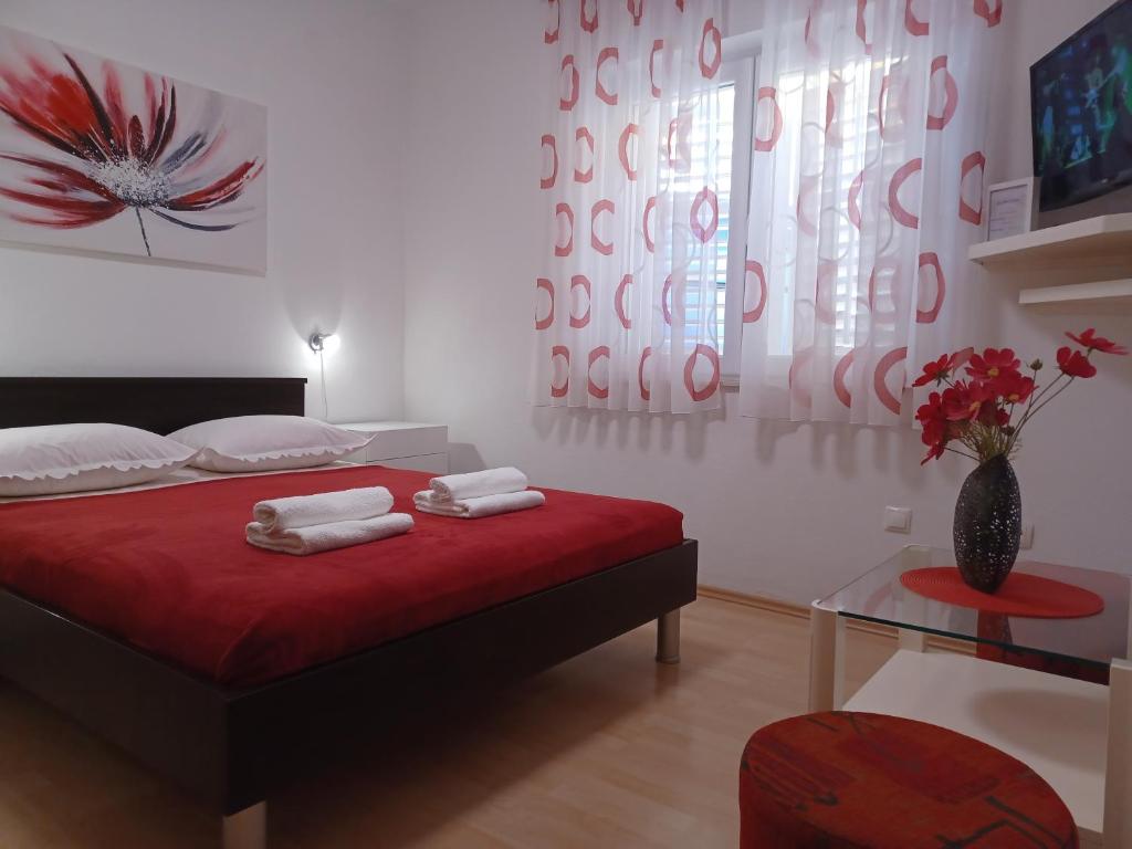 Posteľ alebo postele v izbe v ubytovaní MG Ravlic Apartments