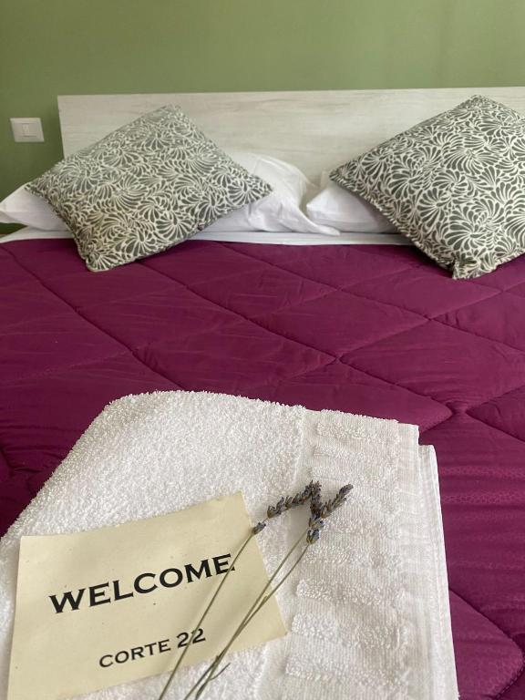 Posteľ alebo postele v izbe v ubytovaní Corte 22 B&b e Appartamenti