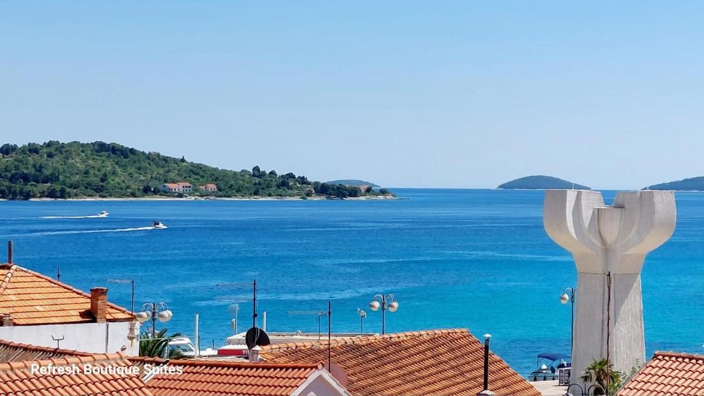 a view of the ocean from the roofs of houses at Refresh Boutique Suites - NEW in Vodice