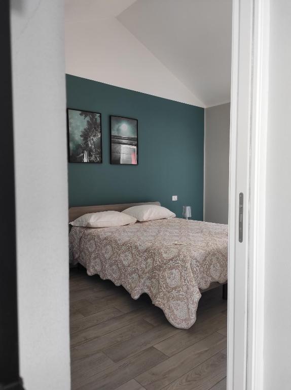 Posteľ alebo postele v izbe v ubytovaní Corte 22 B&b e Appartamenti
