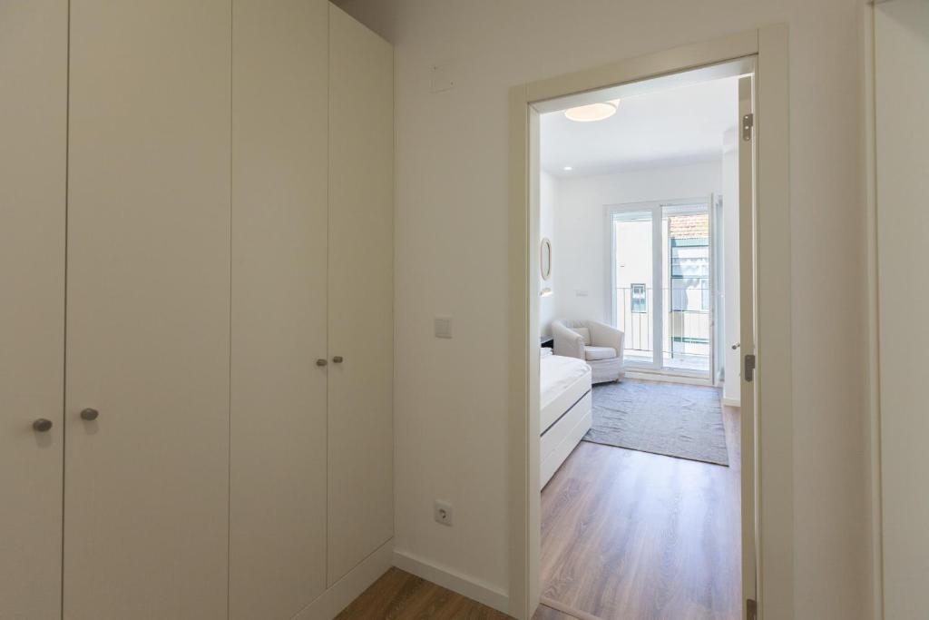 Postel nebo postele na pokoji v ubytování FLH Penha França Art Apartment