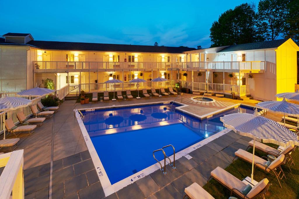 a hotel with a swimming pool and a resort at Greenporter Hotel in Greenport