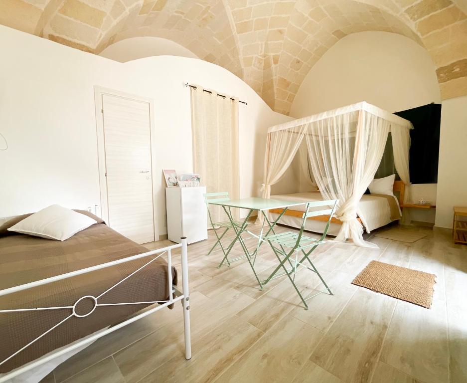 Postel nebo postele na pokoji v ubytování B&B Borgo Monacizzo