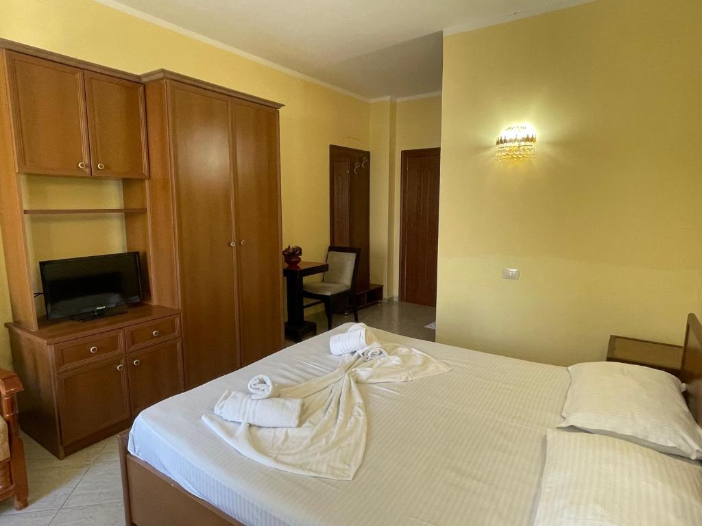 Postel nebo postele na pokoji v ubytování Sanremo Hotel Restorant