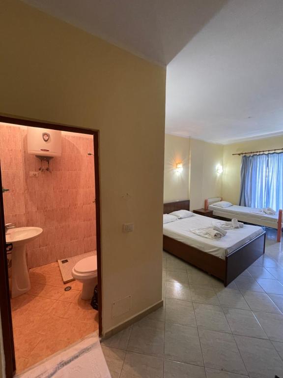 Postel nebo postele na pokoji v ubytování Sanremo Hotel Restorant