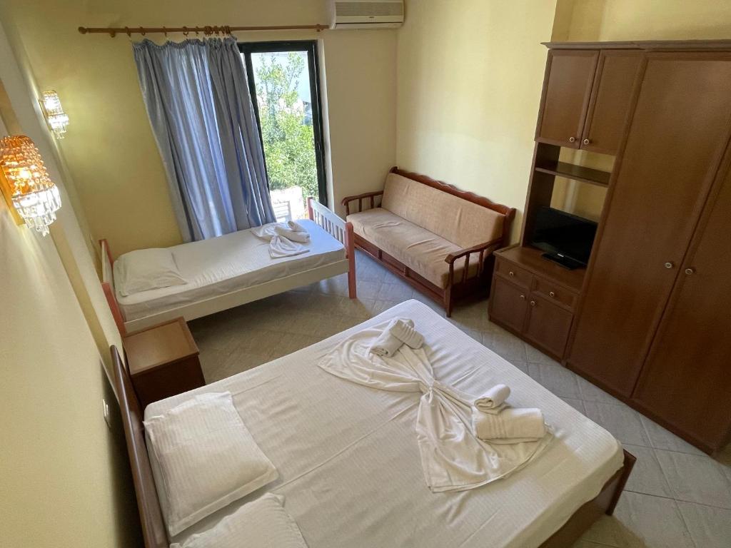 Postel nebo postele na pokoji v ubytování Sanremo Hotel Restorant