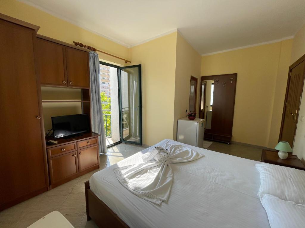 Postel nebo postele na pokoji v ubytování Sanremo Hotel Restorant