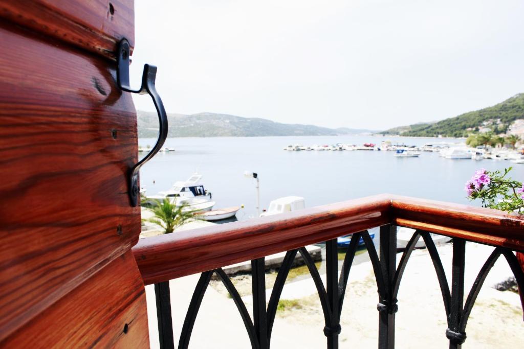 a balcony with a view of a body of water at Villa Kula in Trogir