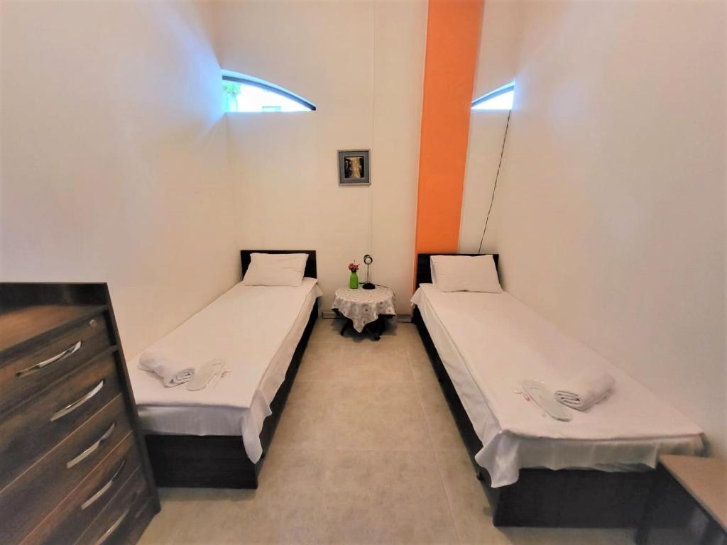 Postel nebo postele na pokoji v ubytování Hostel Near The Square