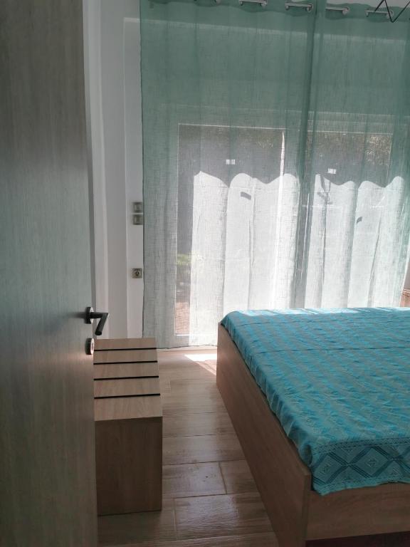 Postel nebo postele na pokoji v ubytování IRINI'S HOUSE