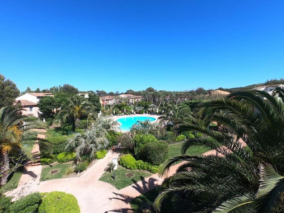 an aerial view of a resort with a pool and palm trees at Presqu&#39;ile de Giens - Hameau de la Pinede in Hyères