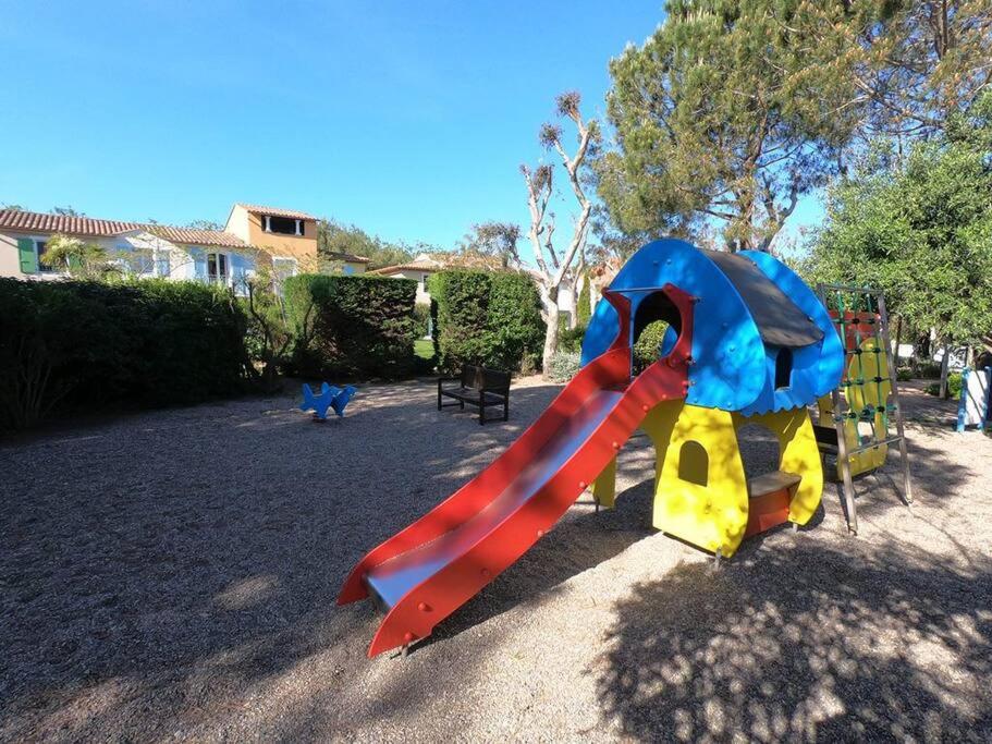 a playground with a slide in a park at Presqu&#39;ile de Giens - Hameau de la Pinede in Hyères