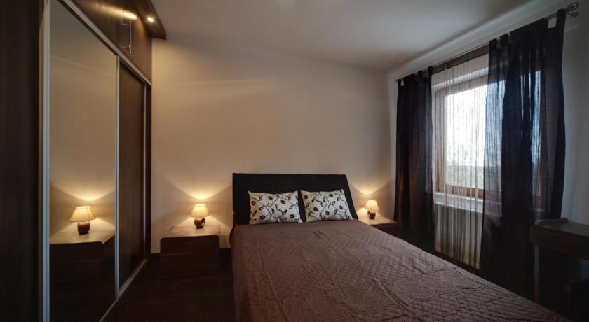 Posteľ alebo postele v izbe v ubytovaní Apartament Urocza