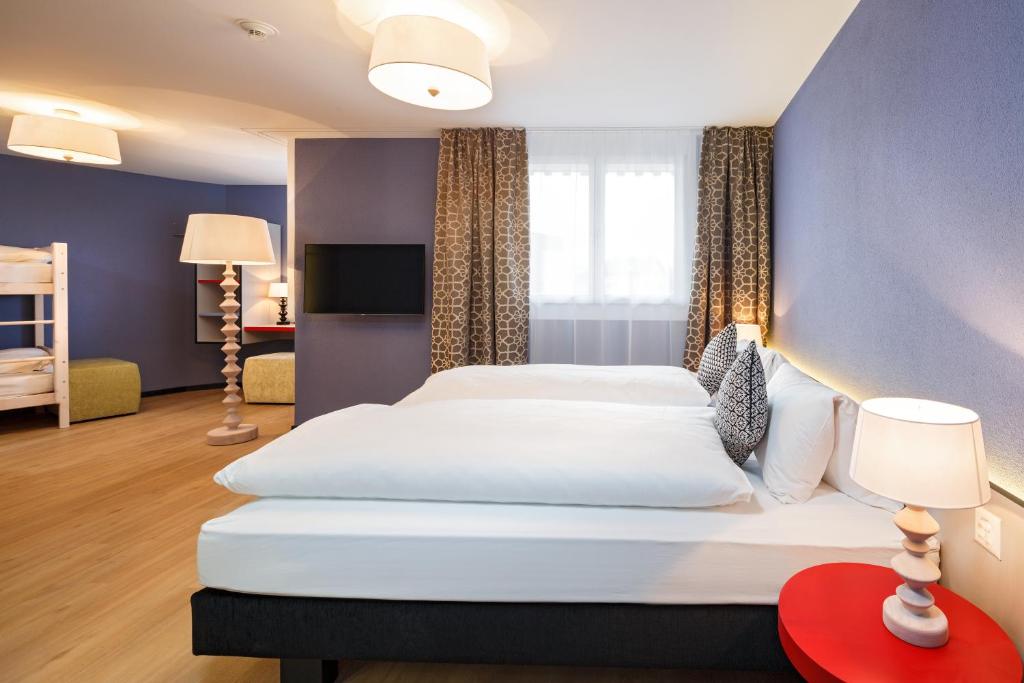 Postel nebo postele na pokoji v ubytování Hotel & Restaurant Chärnsmatt