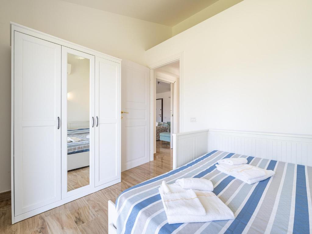 A bed or beds in a room at Villa Lunu