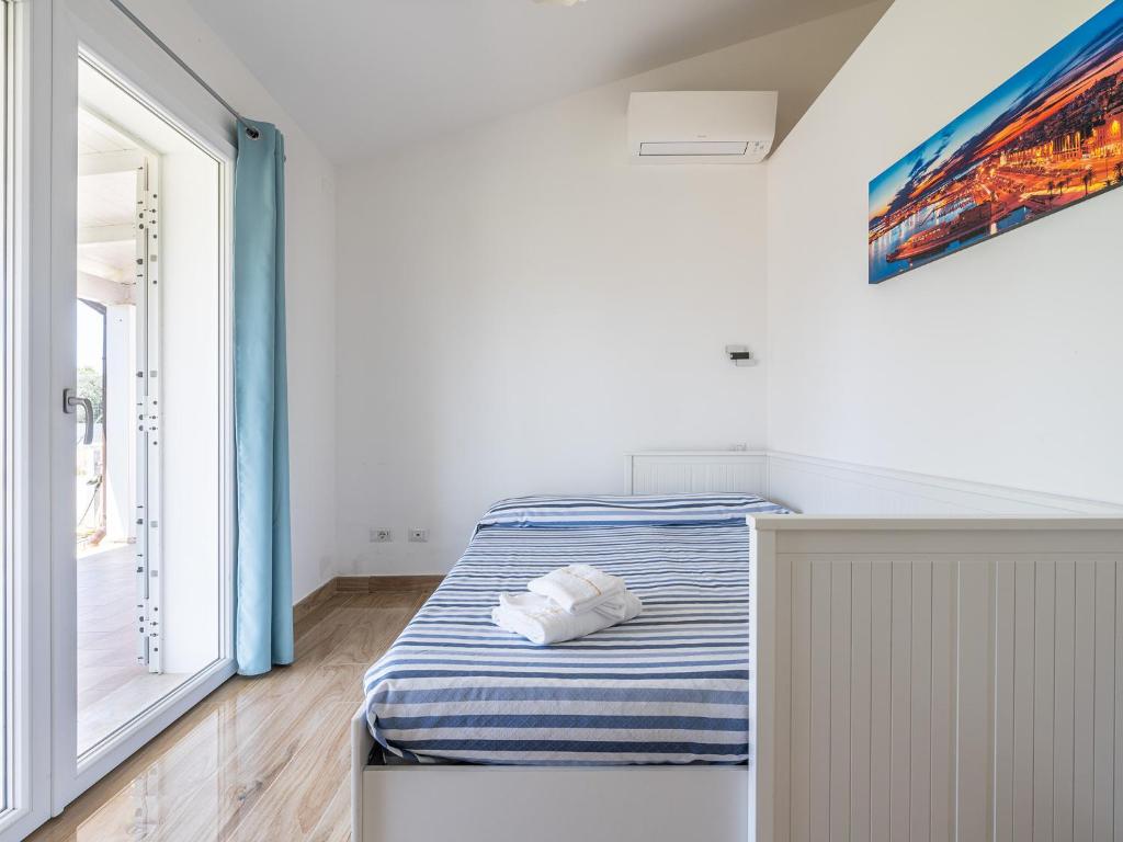 A bed or beds in a room at Villa Lunu