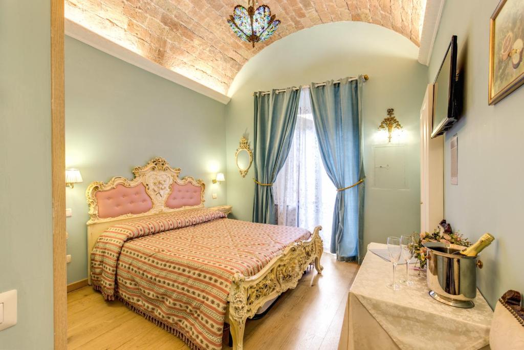 Postel nebo postele na pokoji v ubytování La Reggia dei Principi