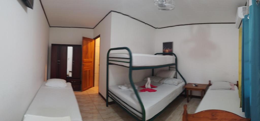 Postel nebo postele na pokoji v ubytování Cabinas Smith