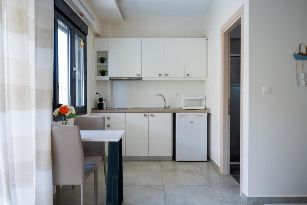 Kuchyň nebo kuchyňský kout v ubytování Callista Suites