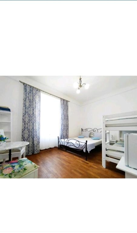 Postel nebo postele na pokoji v ubytování Guest House Izola